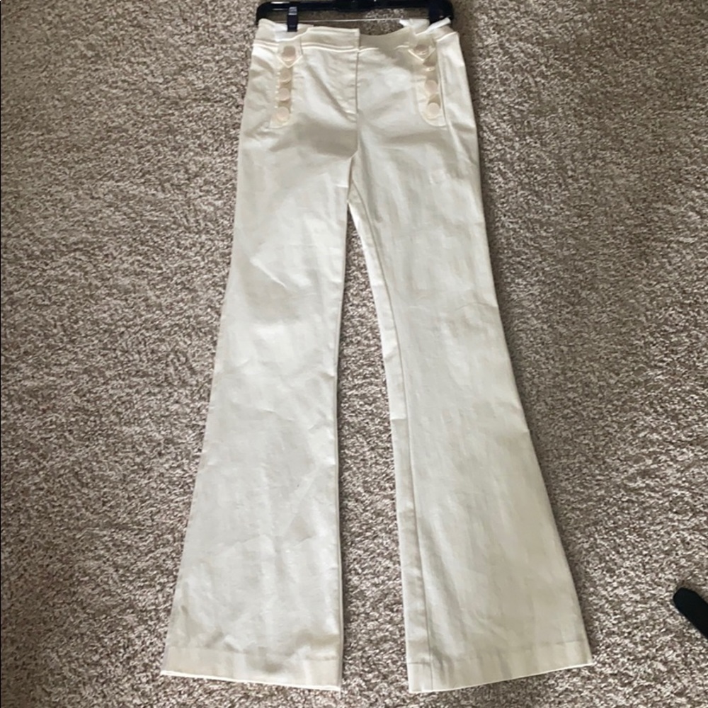 Trendy buttoned cream pants. Never worn, NWT